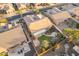 Aerial view showcasing a well-maintained backyard with a pergola covered patio, landscaping, and water feature at 4756 W Nogales Way, Eloy, AZ 85131