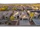 Stunning aerial view of a two-story home with desert landscaping, tile roof and three-car garage in a beautiful neighborhood at 4756 W Nogales Way, Eloy, AZ 85131