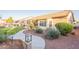 Beautiful backyard with large patio, lush grass, outdoor kitchen and desert landscaping at 4756 W Nogales Way, Eloy, AZ 85131