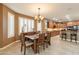 Formal dining room features a chandelier, window shutters and an open view to kitchen at 4756 W Nogales Way, Eloy, AZ 85131