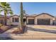 Inviting single-Gathering home boasting a three-car garage, desert landscaping, and mature trees at 4756 W Nogales Way, Eloy, AZ 85131