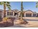 Charming single-Gathering home featuring desert landscaping, a three-car garage, and tile roof at 4756 W Nogales Way, Eloy, AZ 85131