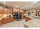 Spacious kitchen featuring stainless steel appliances, lots of cabinets, and tiled floors at 4756 W Nogales Way, Eloy, AZ 85131