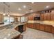 Gourmet kitchen features granite countertops, stainless steel sink, and ample counter space at 4756 W Nogales Way, Eloy, AZ 85131