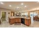 Large kitchen island features a sink, cabinets, granite counters and dishwasher at 4756 W Nogales Way, Eloy, AZ 85131