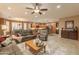 Open-concept living room featuring tile floors, warm paint, and a connecting kitchen at 4756 W Nogales Way, Eloy, AZ 85131