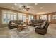 Open-concept living area with tile floors, plantation shutters, and comfortable seating at 4756 W Nogales Way, Eloy, AZ 85131