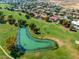 Aerial view of a tranquil pond on a meticulously maintained golf course at 4915 N Greentree Dr, Litchfield Park, AZ 85340