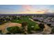 Picturesque golf course view at sunset, surrounded by a beautiful residential area at 4915 N Greentree Dr, Litchfield Park, AZ 85340