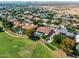 Stunning aerial view of a home with a swimming pool overlooking the golf course at 4915 N Greentree Dr, Litchfield Park, AZ 85340