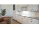 Bar area with white cabinets, granite counters, and recessed lighting at 4915 N Greentree Dr, Litchfield Park, AZ 85340