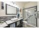 Well-lit bathroom featuring a walk-in shower and stylish vanity with a modern sink at 4915 N Greentree Dr, Litchfield Park, AZ 85340