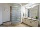 This bathroom features a glass block shower wall and modern finishes at 4915 N Greentree Dr, Litchfield Park, AZ 85340