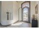 Welcoming foyer features tiled flooring, light walls, an art niche, and an iron grid door with a vent at 4915 N Greentree Dr, Litchfield Park, AZ 85340