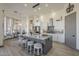 Open floor plan with island seating in kitchen featuring white cabinets and stainless appliances at 4915 N Greentree Dr, Litchfield Park, AZ 85340