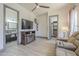 Inviting living room with modern ceiling fan and a view to the bathroom and closet at 4915 N Greentree Dr, Litchfield Park, AZ 85340