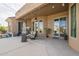 Expansive patio with outdoor seating, a ceiling fan, and access to the backyard at 4915 N Greentree Dr, Litchfield Park, AZ 85340