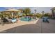 Resort-style pool with rock features, lush landscaping, and ample space for outdoor enjoyment at 4915 N Greentree Dr, Litchfield Park, AZ 85340