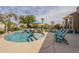 Resort-style pool with rock features, lush landscaping, and ample space for outdoor enjoyment at 4915 N Greentree Dr, Litchfield Park, AZ 85340