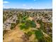 Lush green golf course community with mature trees and well-manicured fairways, creating an inviting outdoor experience at 4939 W Joyce Cir, Glendale, AZ 85308