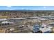 Aerial view of a shopping center with restaurants, retail stores, and parking, nearby the residential area at 4939 W Joyce Cir, Glendale, AZ 85308