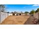 Spacious, fenced backyard featuring a block wall, and ample space for recreation and gardening at 4939 W Joyce Cir, Glendale, AZ 85308