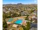 Aerial view of the community park with a pool, playground, basketball court and green space at 4939 W Joyce Cir, Glendale, AZ 85308