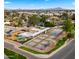 Aerial view of community amenities, including tennis courts, playground, and green space at 4939 W Joyce Cir, Glendale, AZ 85308