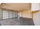 Spacious garage with white garage door, providing ample parking and storage space, adding convenience to daily living at 4939 W Joyce Cir, Glendale, AZ 85308