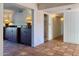 Spacious hallway featuring tile floors, white walls, and storage cabinets at 537 N Jay St, Chandler, AZ 85225