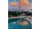 Captivating pool at sunset, offering a refreshing escape and scenic views with a diving board at 537 N Jay St, Chandler, AZ 85225