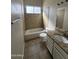 Clean bathroom with tiled shower/tub, granite vanity, and modern fixtures at 5552 W Willow Ave, Glendale, AZ 85304