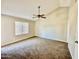 Spacious bedroom featuring neutral-colored walls and carpet with large window that provides natural light at 5552 W Willow Ave, Glendale, AZ 85304