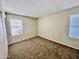 Carpeted bedroom featuring neutral walls and window with natural light at 5552 W Willow Ave, Glendale, AZ 85304