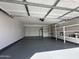 The garage is equipped with built-in shelving, storage space and new epoxy flooring at 5552 W Willow Ave, Glendale, AZ 85304