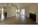 Bright living room features tile flooring, fireplace, ceiling fan, and sliding door to a screened-in patio at 5552 W Willow Ave, Glendale, AZ 85304