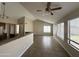 Spacious living room with vaulted ceiling, tile floor, and large window at 5552 W Willow Ave, Glendale, AZ 85304