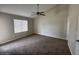 Bright bedroom with ceiling fan, and window at 5552 W Willow Ave, Glendale, AZ 85304