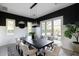 This elegant dining room features a dark wood table with seating for eight, and sliding doors to a backyard at 5601 E Monterosa St, Phoenix, AZ 85018