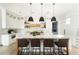 Modern kitchen with sleek white cabinets, a marble island, and stylish pendant lighting at 5601 E Monterosa St, Phoenix, AZ 85018