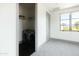 Laundry room with a modern, front load washer and dryer in a bright space with a window at 5601 E Monterosa St, Phoenix, AZ 85018