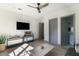 Bright living room featuring a decorative ceiling fan, hardwood floors, and neutral paint at 5601 E Monterosa St, Phoenix, AZ 85018