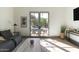 Living room showcasing natural light and a view of the pool and outdoor seating at 5601 E Monterosa St, Phoenix, AZ 85018