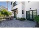 Outdoor patio with brick flooring, dining set, and modern architectural details at 5601 E Monterosa St, Phoenix, AZ 85018