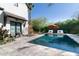 Enjoy a refreshing swim in this backyard pool with lounge chairs and lush landscaping at 5601 E Monterosa St, Phoenix, AZ 85018