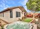 Spacious backyard featuring a hot tub, lush landscaping, and privacy at 6847 W Palo Brea Ln, Peoria, AZ 85383