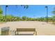 Neighborhood basketball court featuring trees, a shade canopy, and clear blue skies, perfect for residents at 6847 W Palo Brea Ln, Peoria, AZ 85383