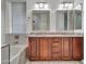 Bathroom features a double vanity with granite countertops and modern fixtures at 6847 W Palo Brea Ln, Peoria, AZ 85383