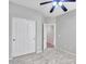 Clean bedroom with tile floors, a ceiling fan, and a closet at 6847 W Palo Brea Ln, Peoria, AZ 85383