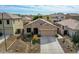 Charming single-story home with a well-manicured xeriscape yard and a two-car garage at 6847 W Palo Brea Ln, Peoria, AZ 85383